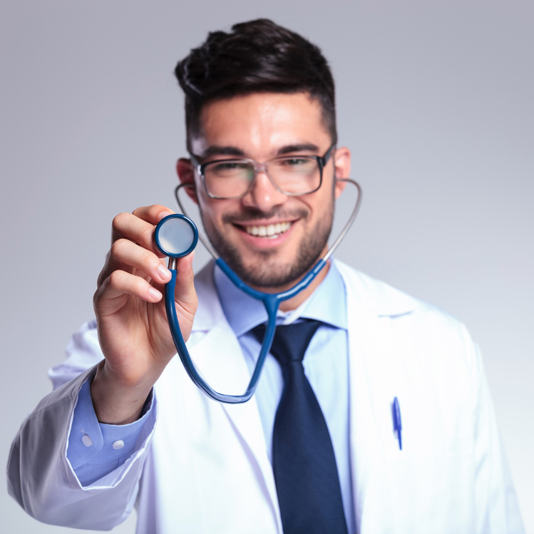 young doctor with stethoscope smiles